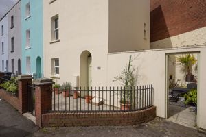 Front courtyard and side access- click for photo gallery